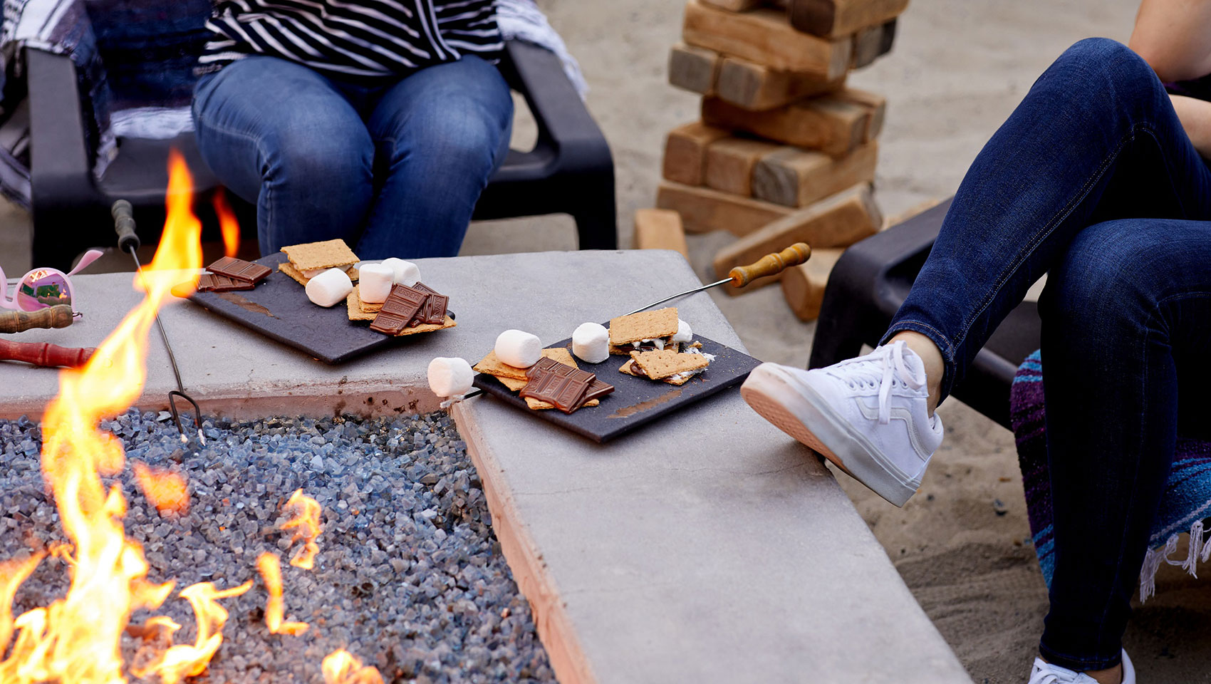 Kimpton Shorebreak guests roasting marshmallow