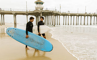 two guys with surfboards