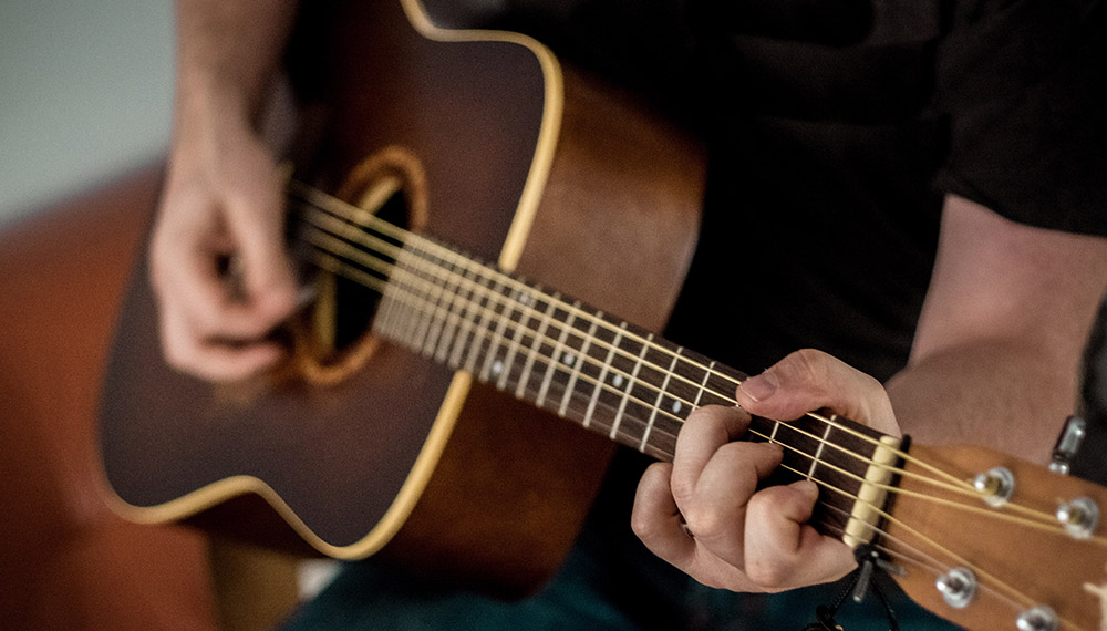 Man playing acoustic guitar