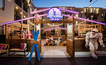 a wooden entrance to Pier Summit Ski Lodge